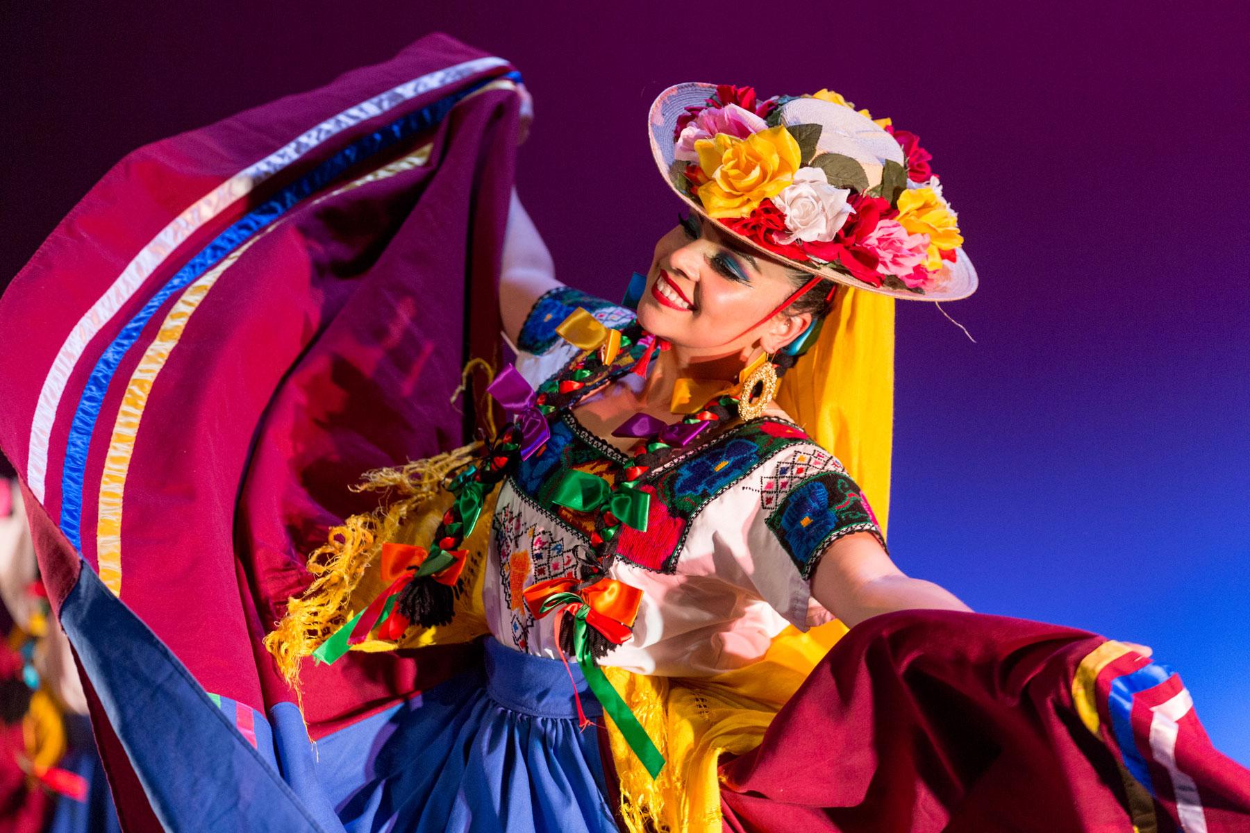 a dancer in colorful regalia.